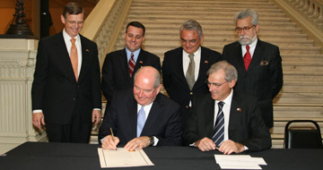 Governor Perdue signing an executive order.
